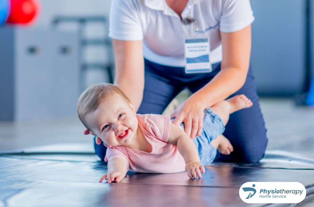 Licensed pediatric home physiotherapy specialist assisting an infant with crawling and developmental milestone exercises.